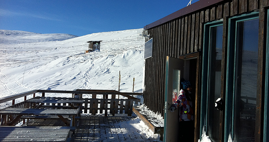 Top station in Abisko, wooden house with outdoor terrace.