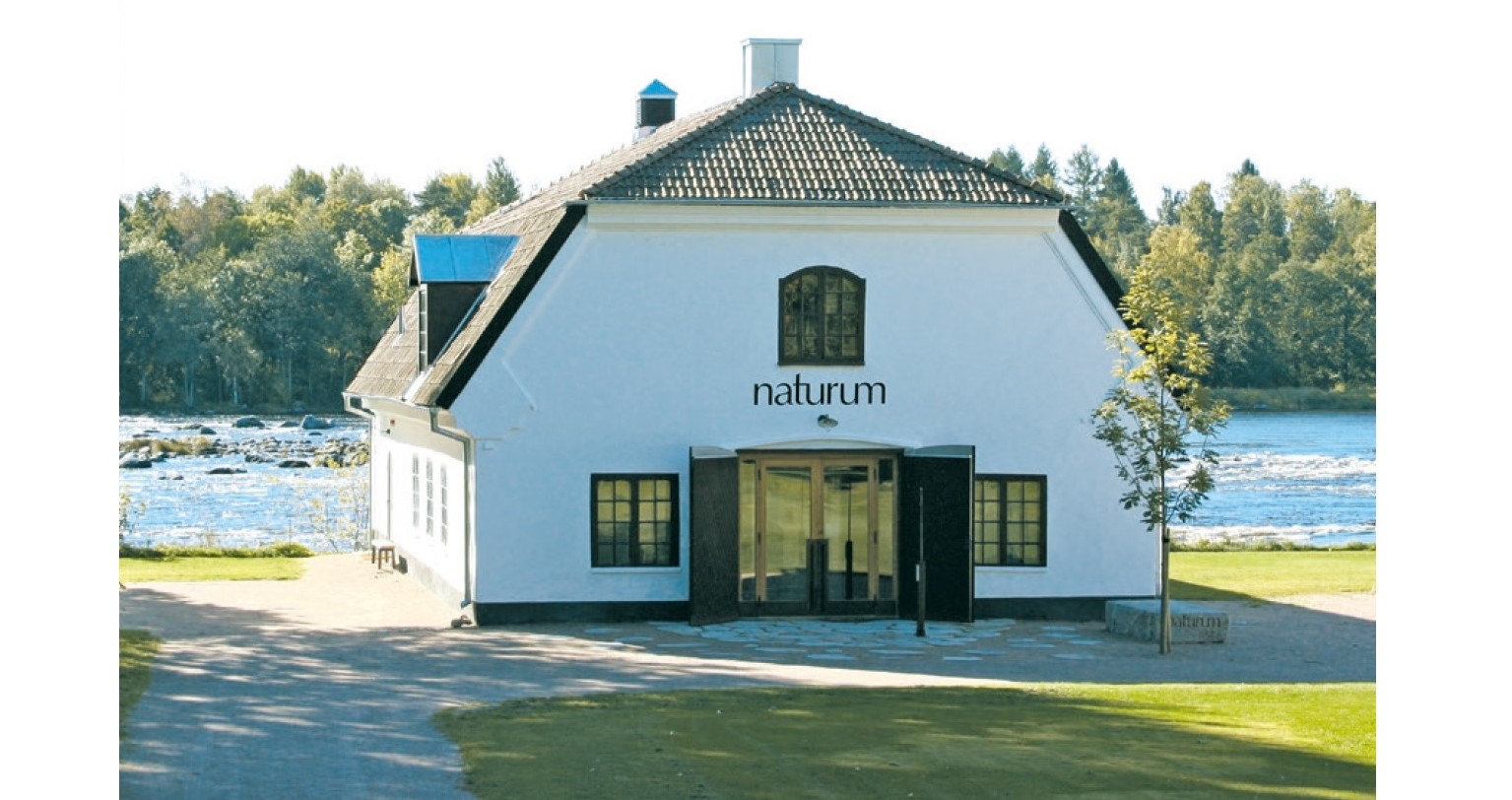 View of the nature house with the water in the background.